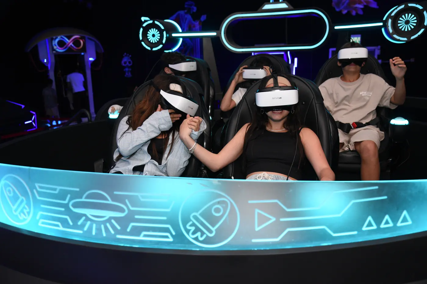 Teens wearing VR headsets on the motion simulator at the Space Run VR venue in Rishon LeZion