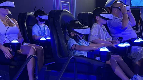 Adults and kids in VR headsets riding the VR6 together