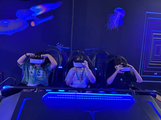 Three kids in VR headsets on the VR6